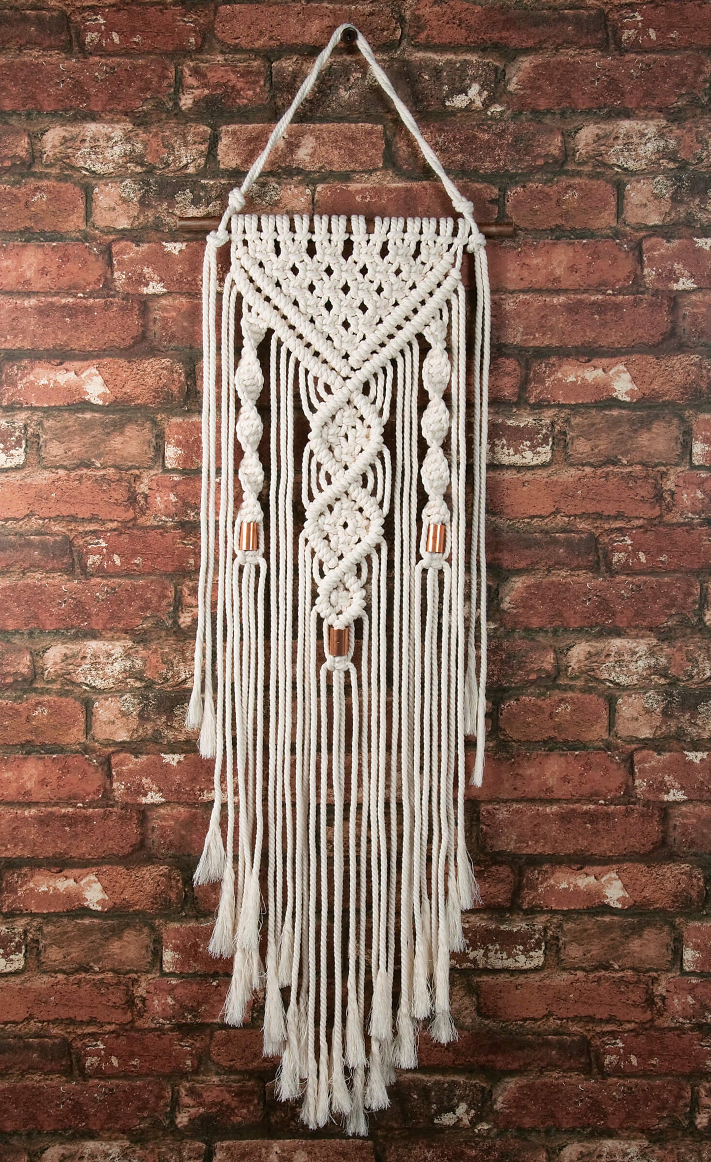 Solid Oak macrame kit "Double Twist" design, shown on brick backgrond