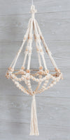 Solid Oak DIY macrame beaded chandelier kit, shown made up. Includes cotton macrame cord, metal hoop, and wood beads. Shown on gray wood wall.