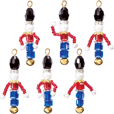 six Toy Soldiers as made from the Solid Oak beaded ornament kit, shown on white.