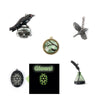 Quoth the Raven set of themed pendants: Raven perched on skull, raven and tree silhouette in round bead-edge frame, pewter-look bird pendant with hinged movable wings, green glass ink bottle pendant with quill feather top, and oval black pendant that glows in the dark. Easy to usee in making distinctive DIY jewelry; just choose your own chain and findings.