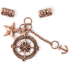 SOlid Oak, Inc. Dangling Charm set, called "Mariner." Copper color metals. Main pendant is large jump ring holding star, compass rose, and chained anchor charms. Also includes a pair of large-hole, metal tube beads with filigree detail.